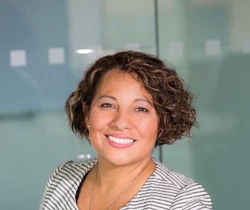 Smiling professional services consultant in a bright office